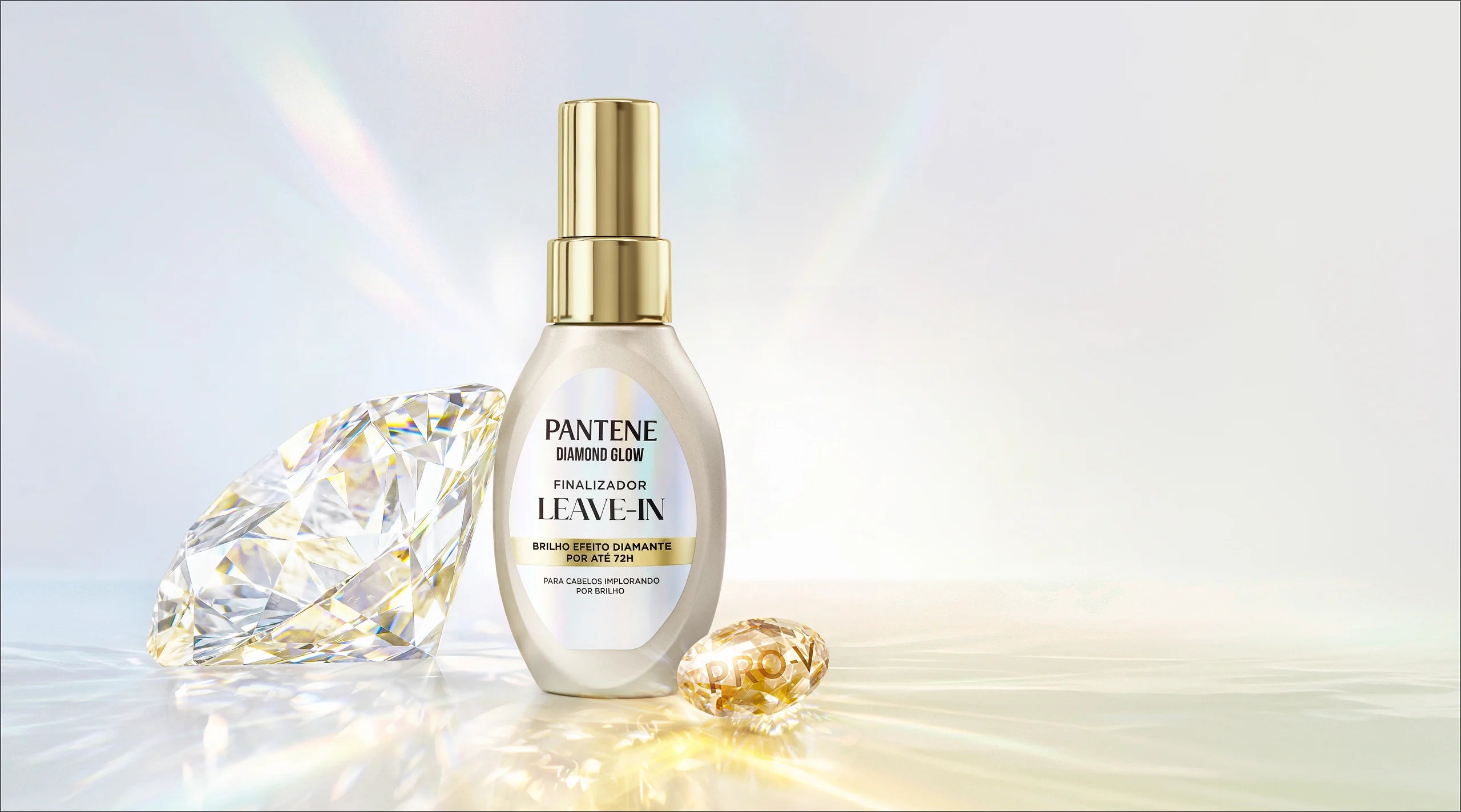 Finalizador Leave-in Diamond Glow com micropartículas de brilho ao lado de um diamante